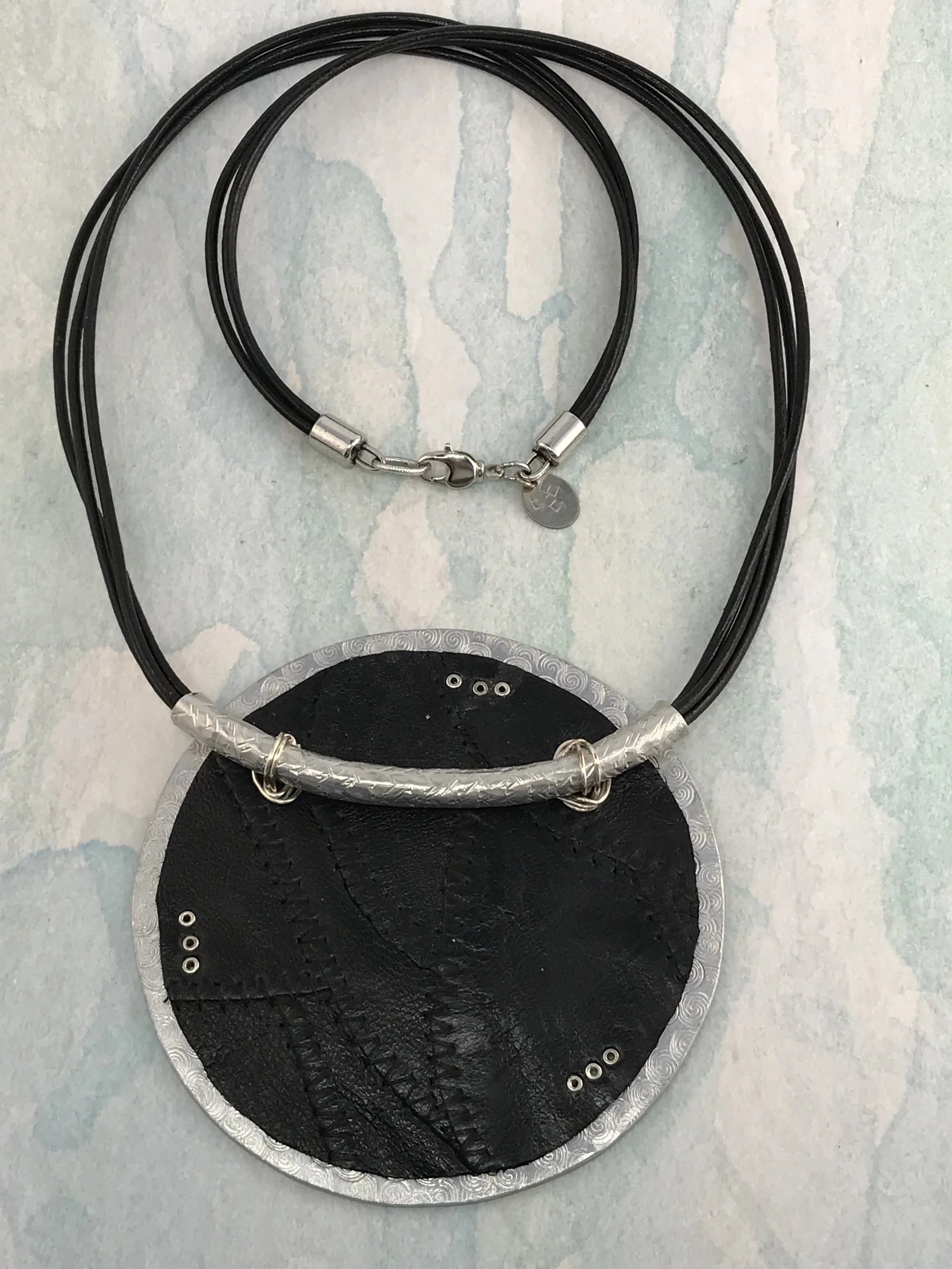 BOLD LEATHER / METAL TEXTURED DISC    Item  #304 N     