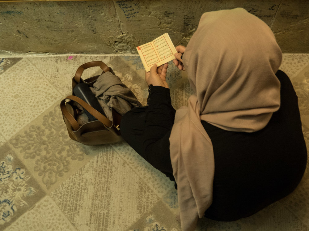 Woman reading Koran