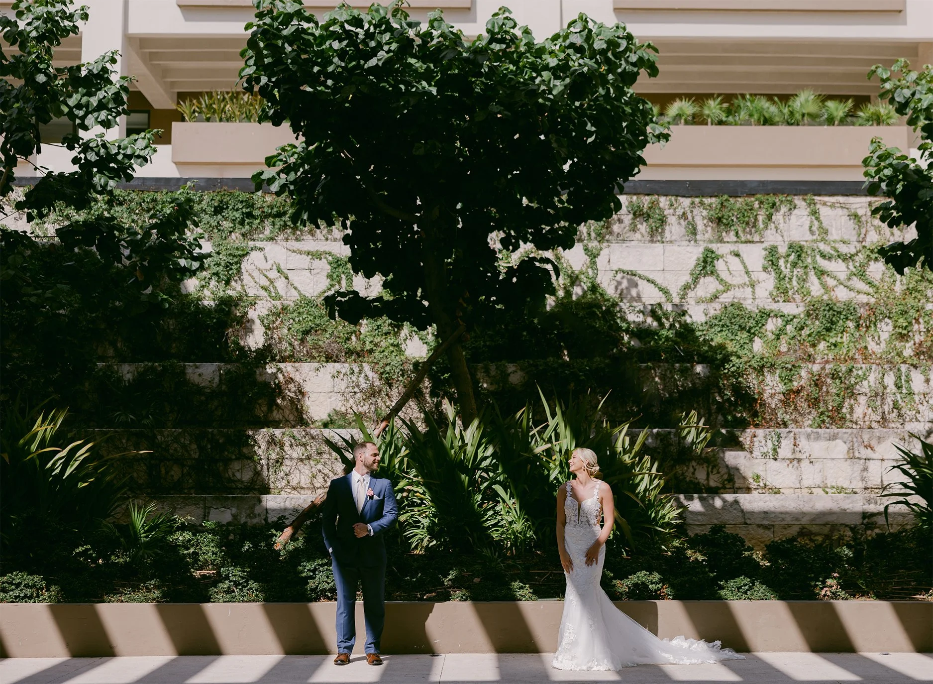 012 Future spouses pose together in the shade of the trees at their hotel in the Riviera Maya.jpg