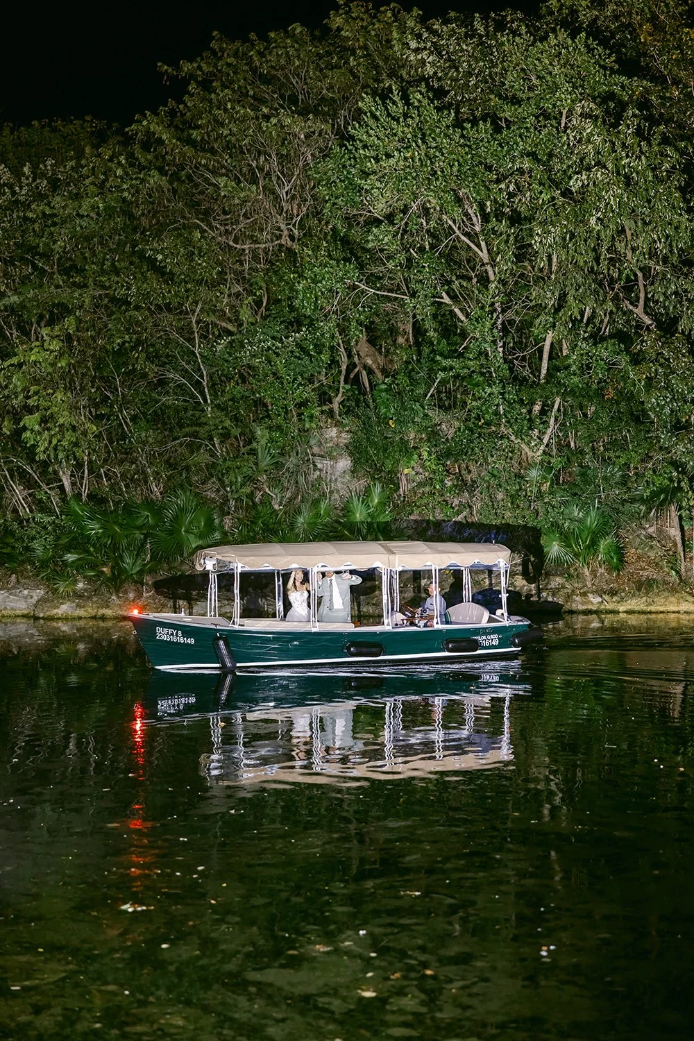 72 bride and groom arriving the wedding reception inside a boat crossing a lake mayakoba riviera maya banyan tree cancun mexico.JPG