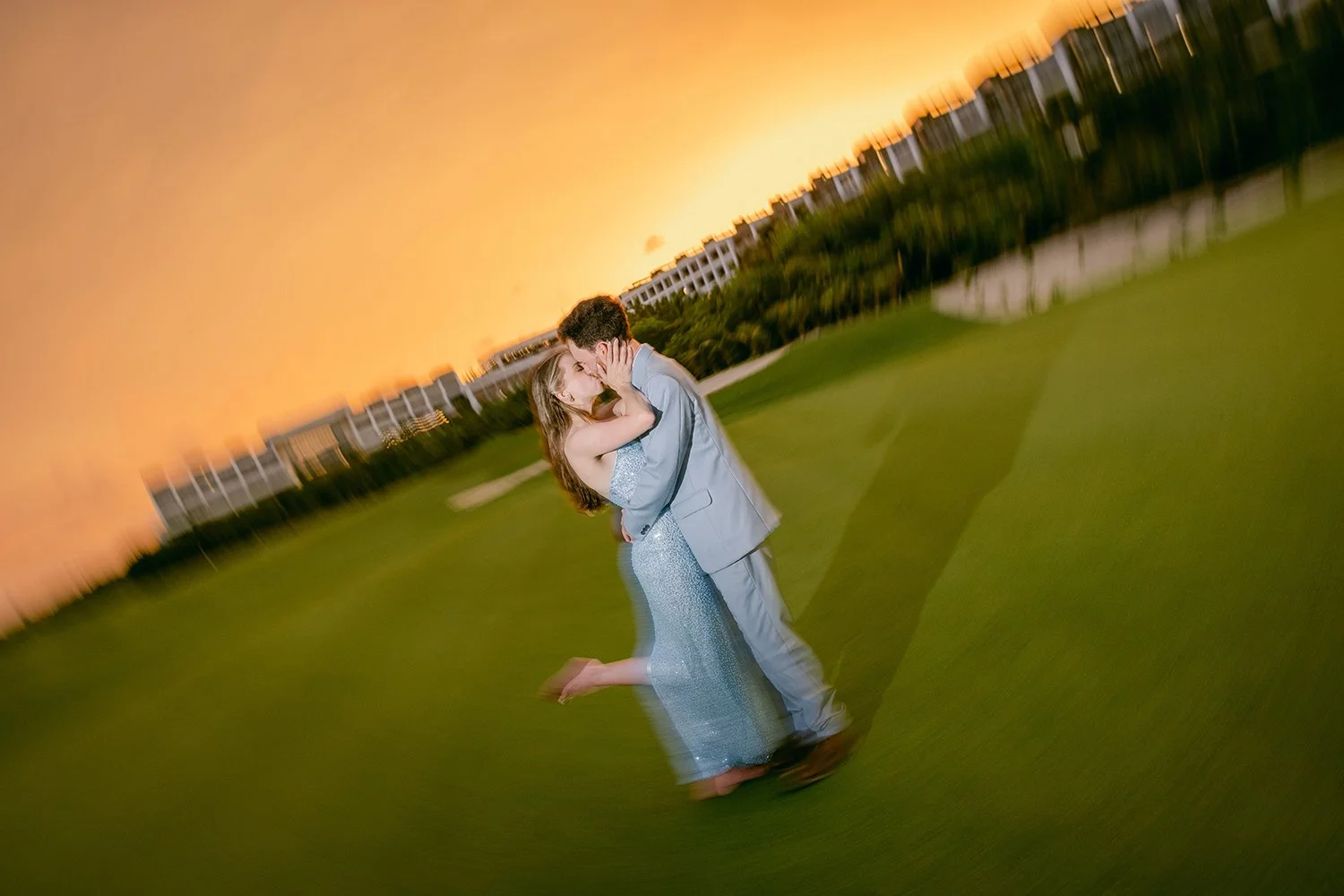 23 amazing sunset golden hour by the golf course bride and groom kiss.JPG