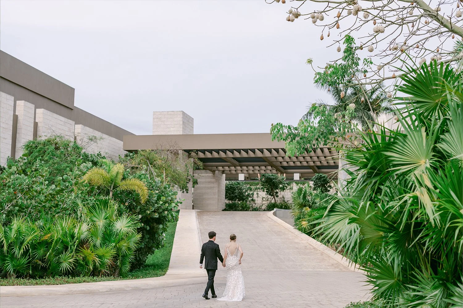 26 bride and groom walking to the wedding ceremony beautiful wide shot tropical cancun riviera maya mexico.JPG