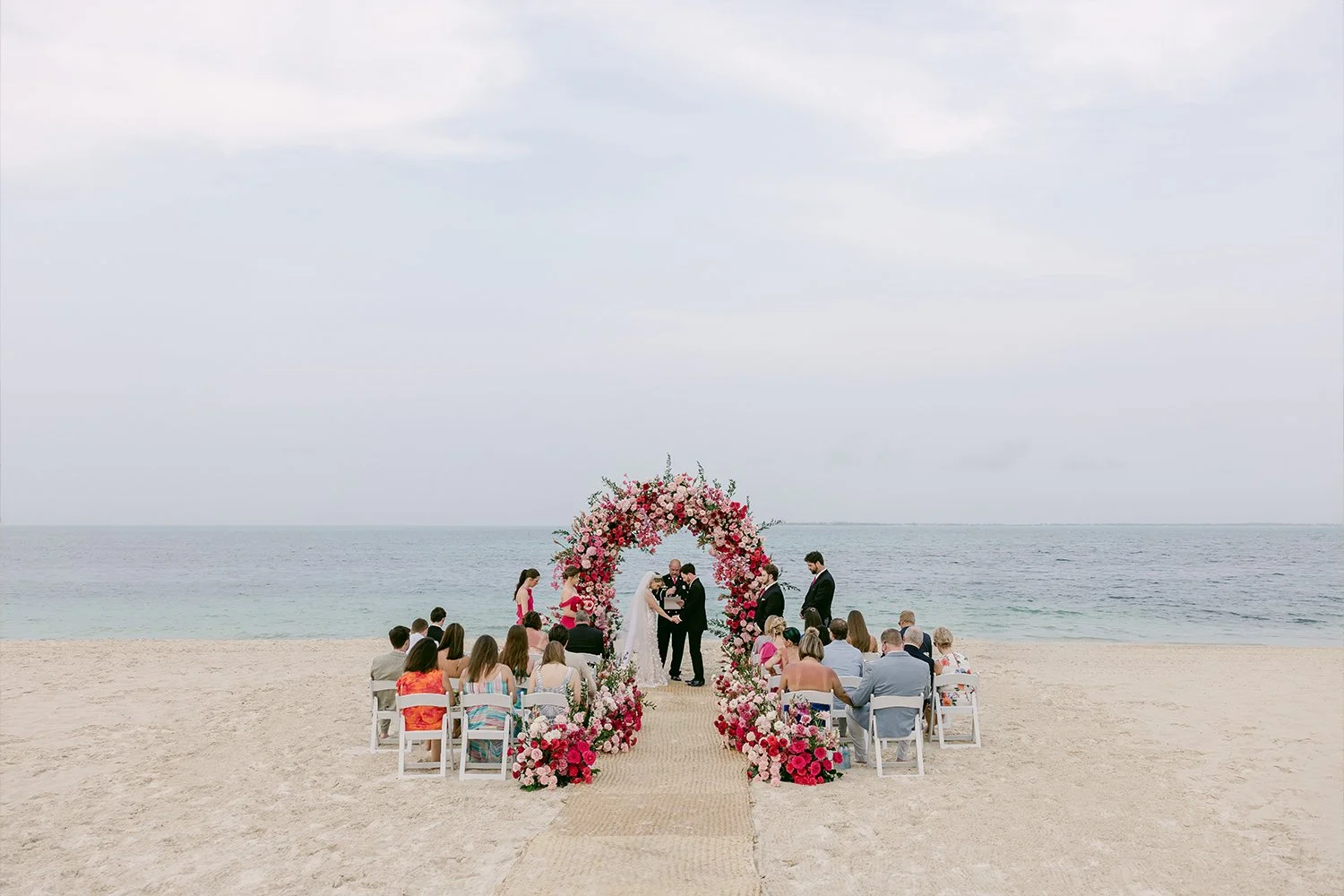 34 amazing clean view of a wedding by the beach with colorful clothes and floral designs.JPG