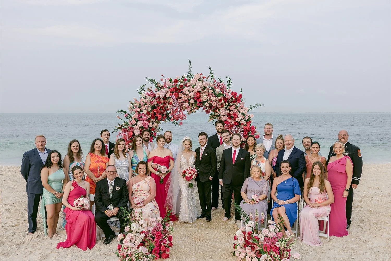 41 bride and groom with bridal party and wedding guests group photo by the beach.JPG
