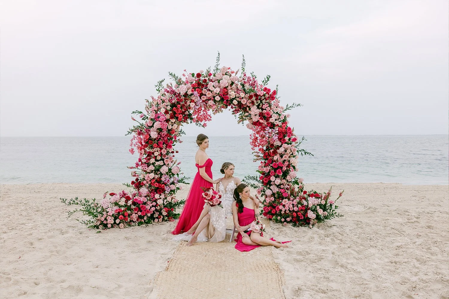 48 beautiful bride with bridesmaids posing down the wedding arch by the beach cancun mexico riviera maya.JPG