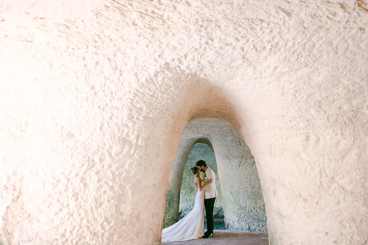 18 bride and groom posing delicately under a cenote cave venue hotel xcaret cancun riviera maya.JPG
