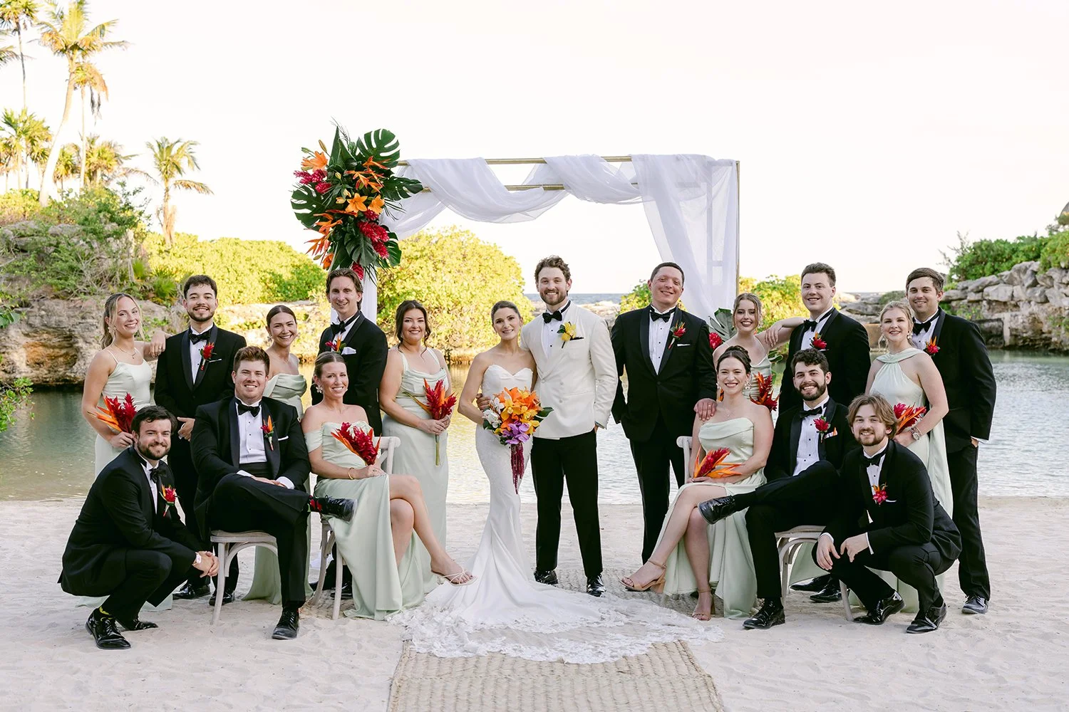 35 nice looking bridal party in black suits with bride and groom and same tone dresses.JPG