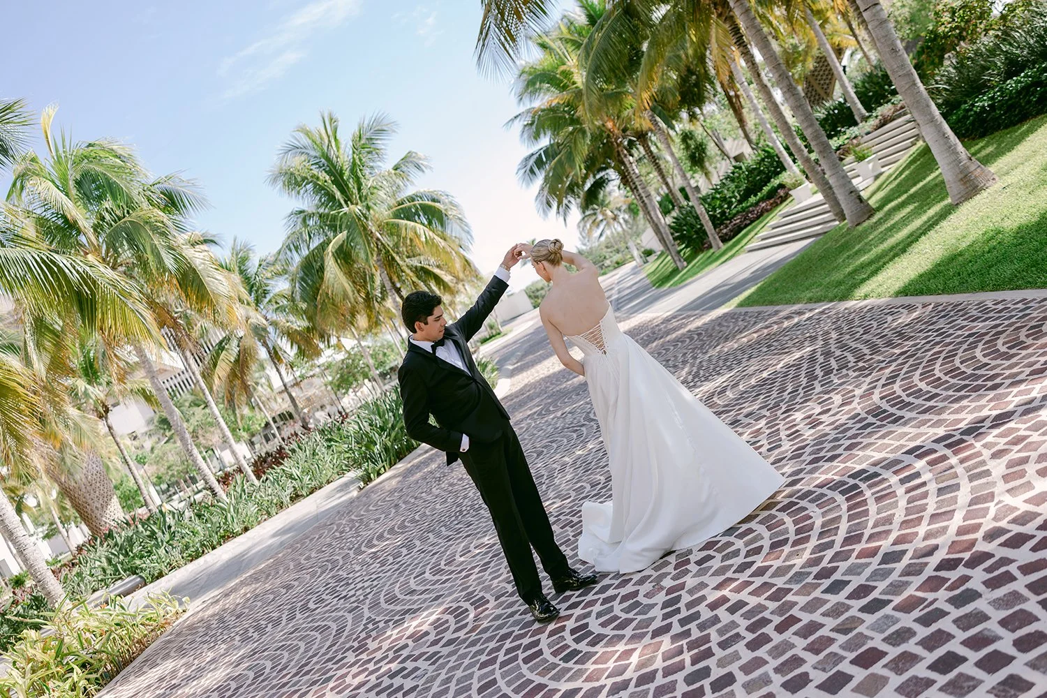 27 bride and groom dancing spinning after the first look showing off her dress.JPG