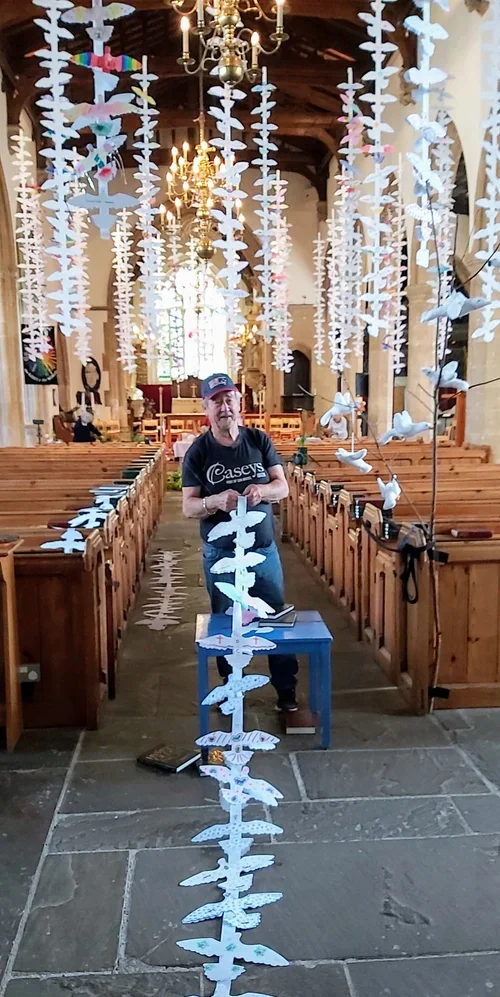  Graham helping display the Peace Doves from the beams. 