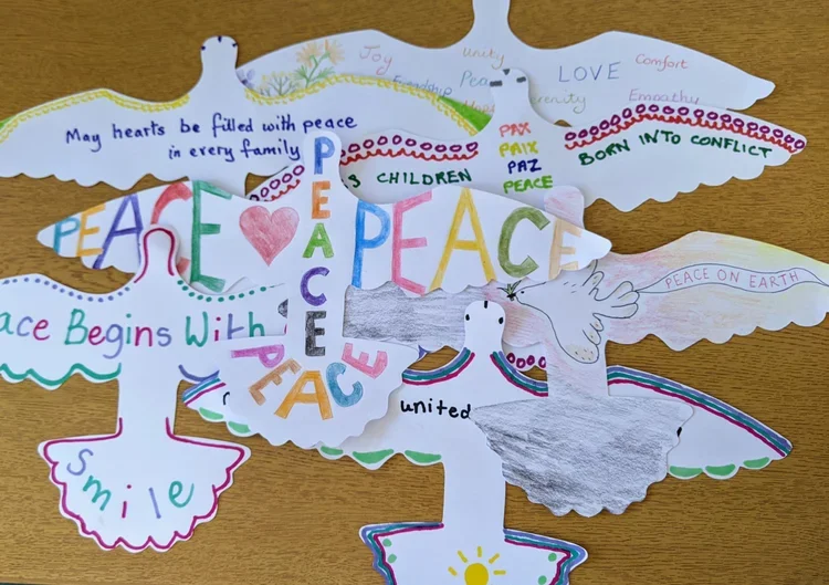 Peace Doves designed by the general public, schools and care homes in Keynsham ready for display in the church.