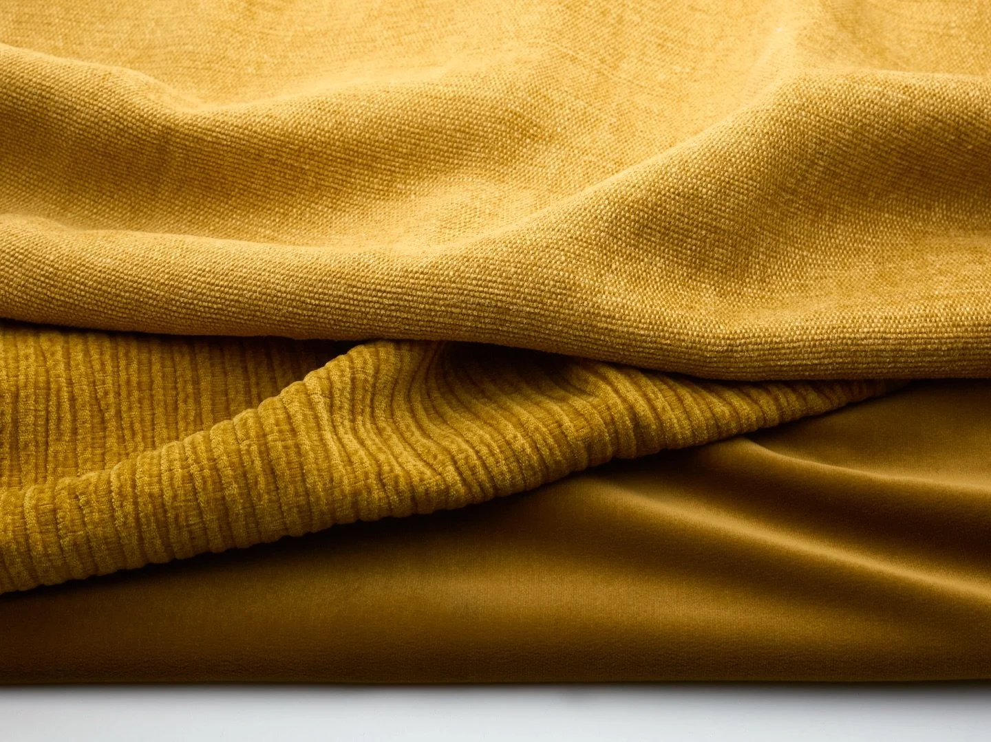 Three textures, one golden moment. ☀️ Ondulato, our newest fabric, layers beautifully with our popular classics Trevi &amp; Endurance. What&rsquo;s your go-to hue this season? Comment below ⬇️, or DM us for a Custom Color Collection! 

#colorinspirat