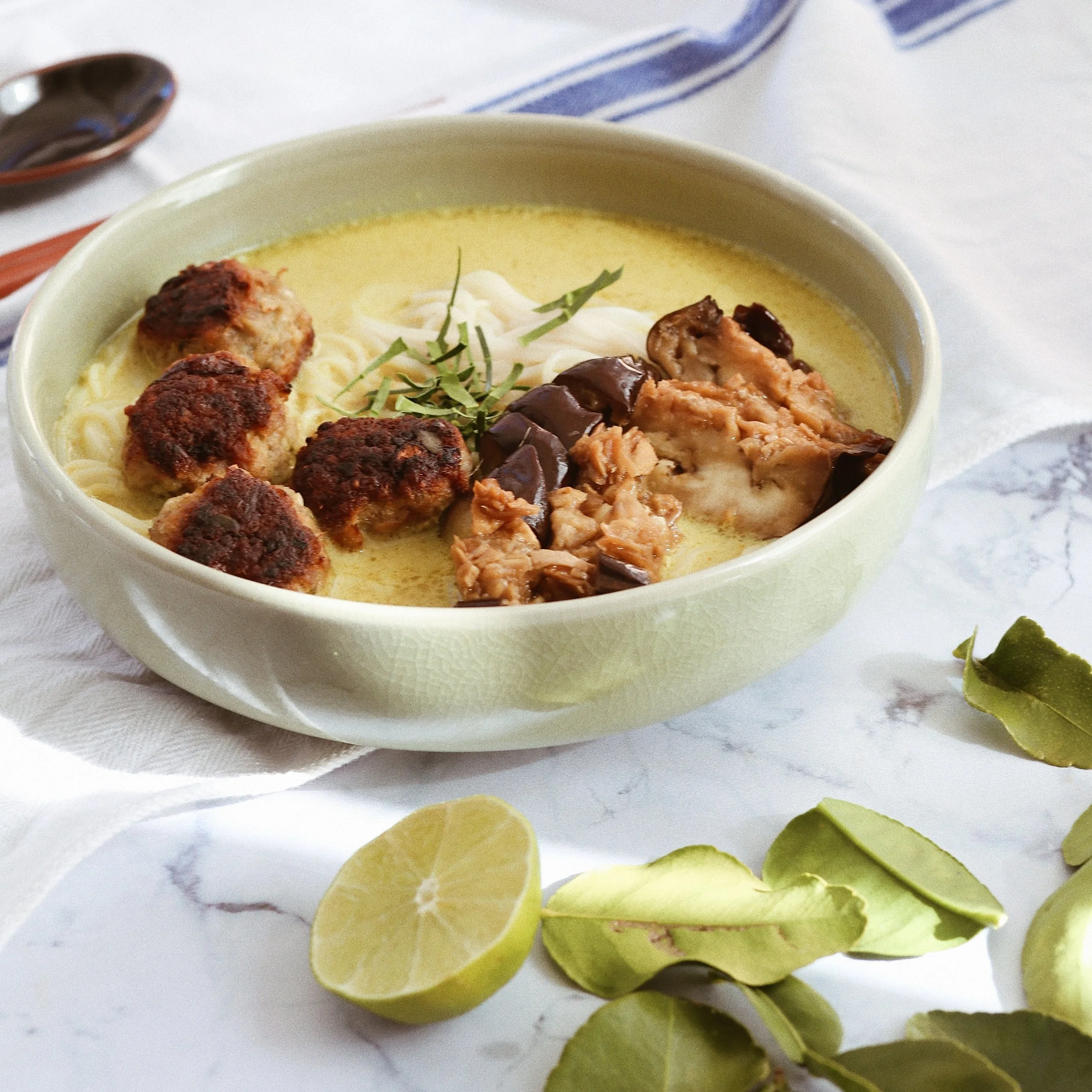 Thai meatballs with roasted eggplant &amp; noodles in green curry broth 