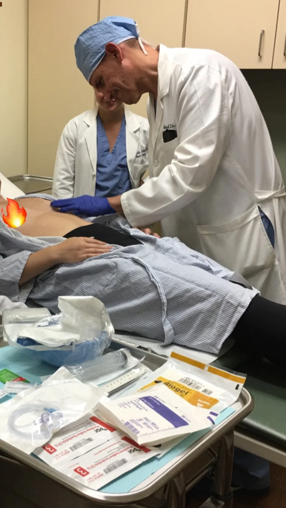 The plastic surgeon who placed my expanders and stitched up my incisions during mastectomy supervising my first expansion