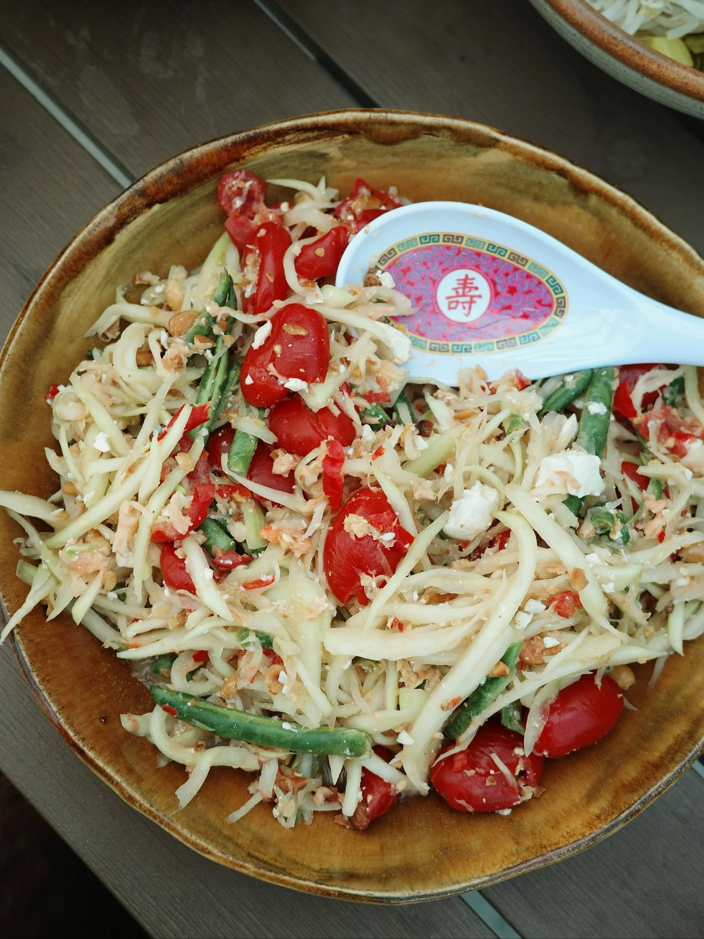sweet potluck for @alidomrongchai&rsquo;s last rooftop hurrah pre-move! nam prik hot dog is going to need a spot in the rotation 😮&zwj;💨

-som tum kai khem / papaya salad with salted egg
-yum woon sen / glass noodle salad with seafood
-khanom jeen 