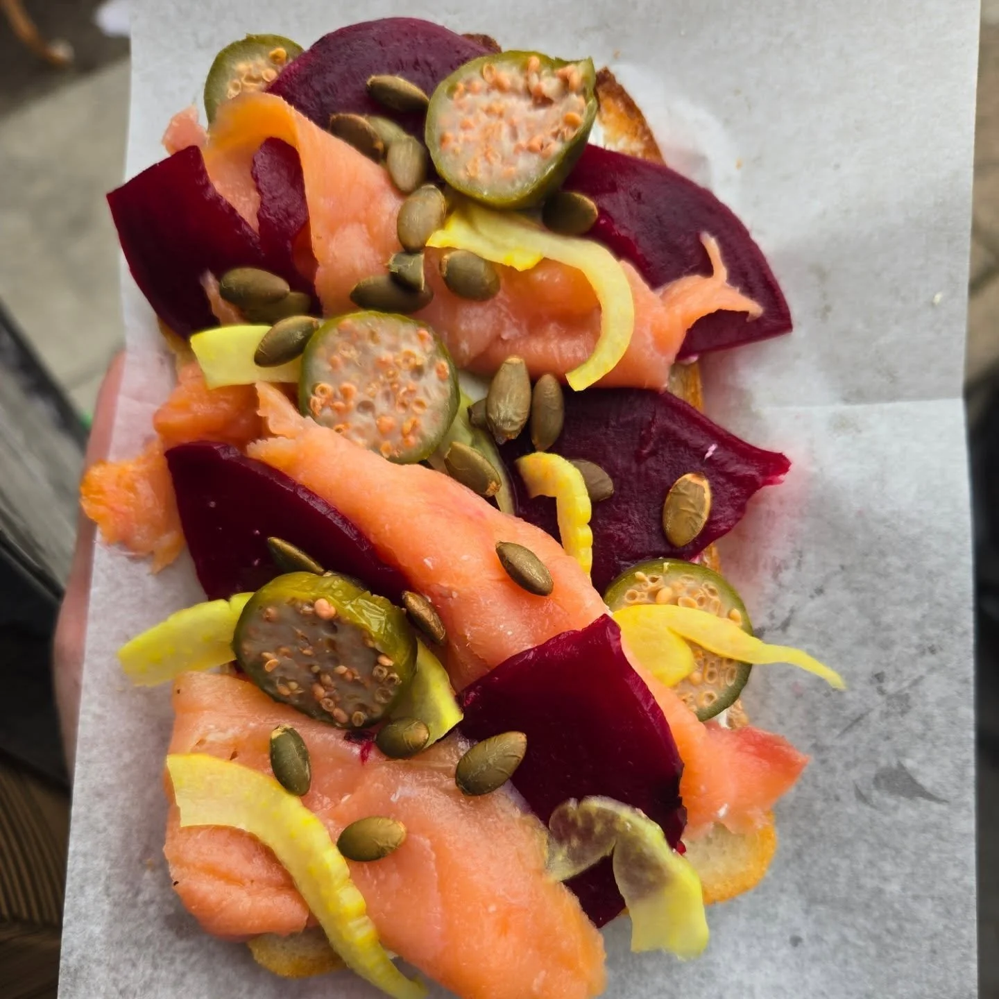 This smoked salmon toast- fall version  is my new favorite!

It's got herb cream  cheese, smoked  salmon, roasted beets, pickled fennel, caperberries, &amp; pumpkin seeds on sourdough. 

Its delicious- briney, earthy, bright, &amp; crunchy. Come get 