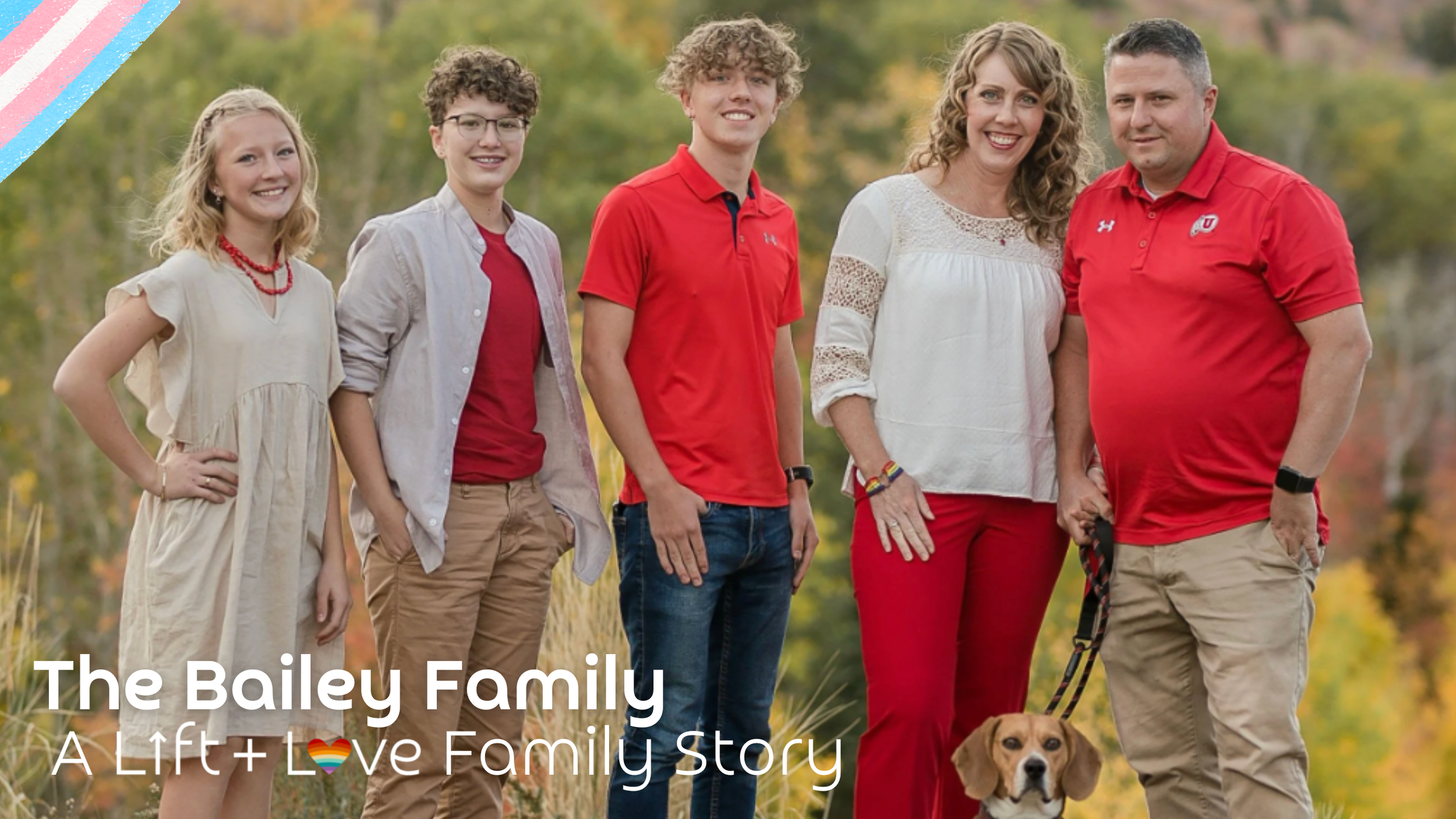 The Bailey Family: a group photo of six family members, including three children, two adults, and a dog outdoors with trees in the background, all dressed in red, beige, and white clothing.