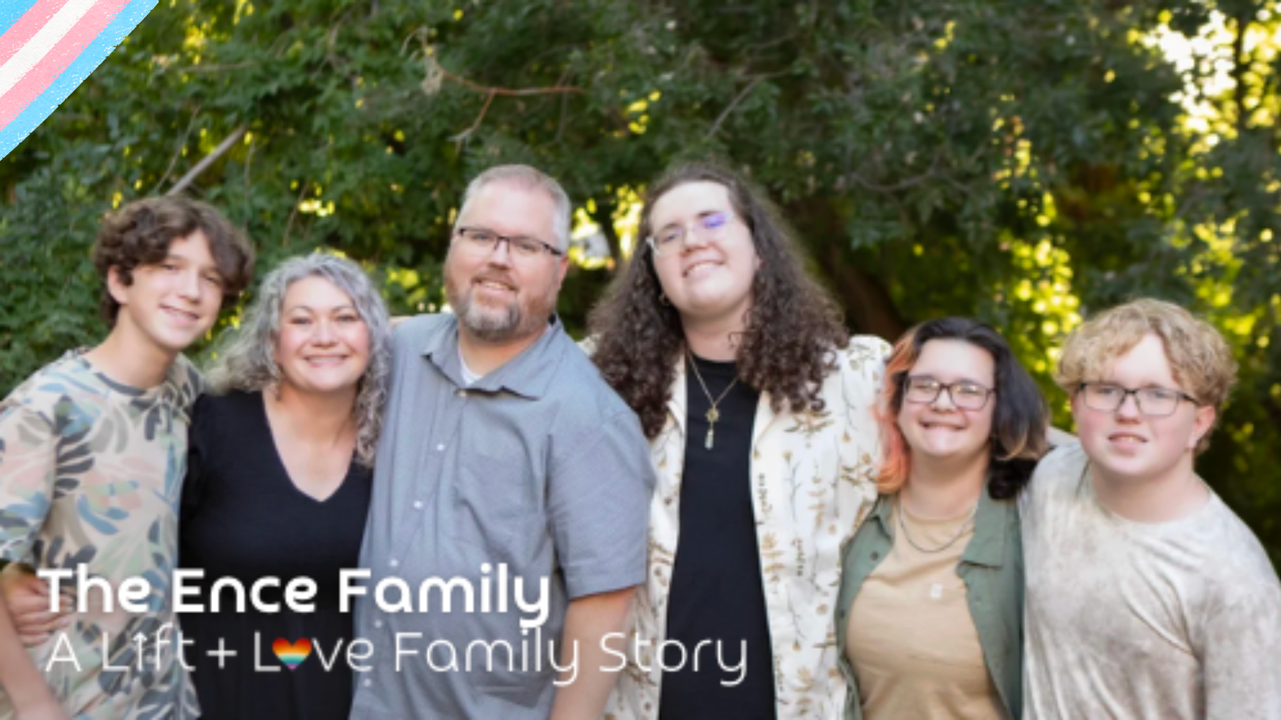 The Ence family, a group of six people, standing outdoors in front of green trees, smiling at the camera. The caption reads: "The Ence Family - A Lift + Love Family Story."