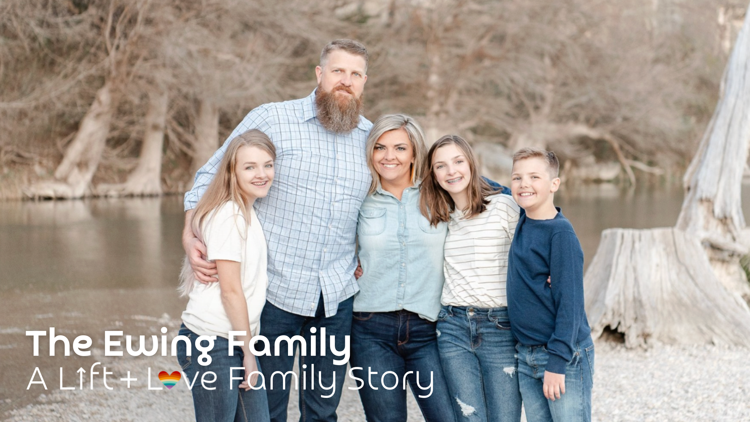 The Ewing family standing outdoors near a river, smiling at the camera. An adult male, an adult female, and three children are present, with trees in the background.