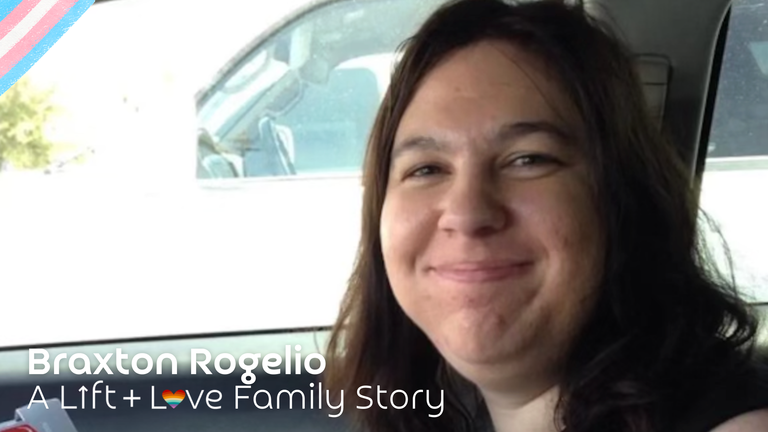 A close-up photo of a smiling woman with long dark hair inside a vehicle, with a white car visible through the window behind her.