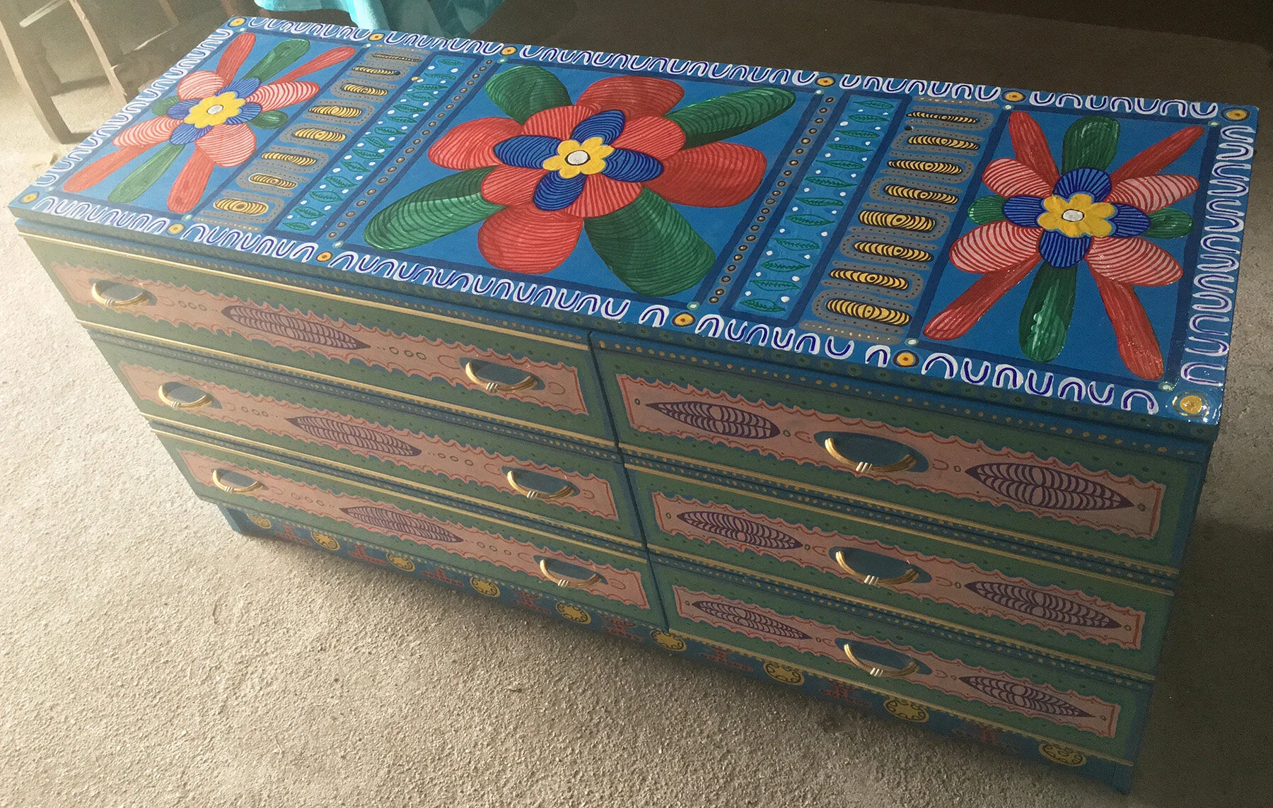 Colourful painted wooden drawers by Taylor Meagher