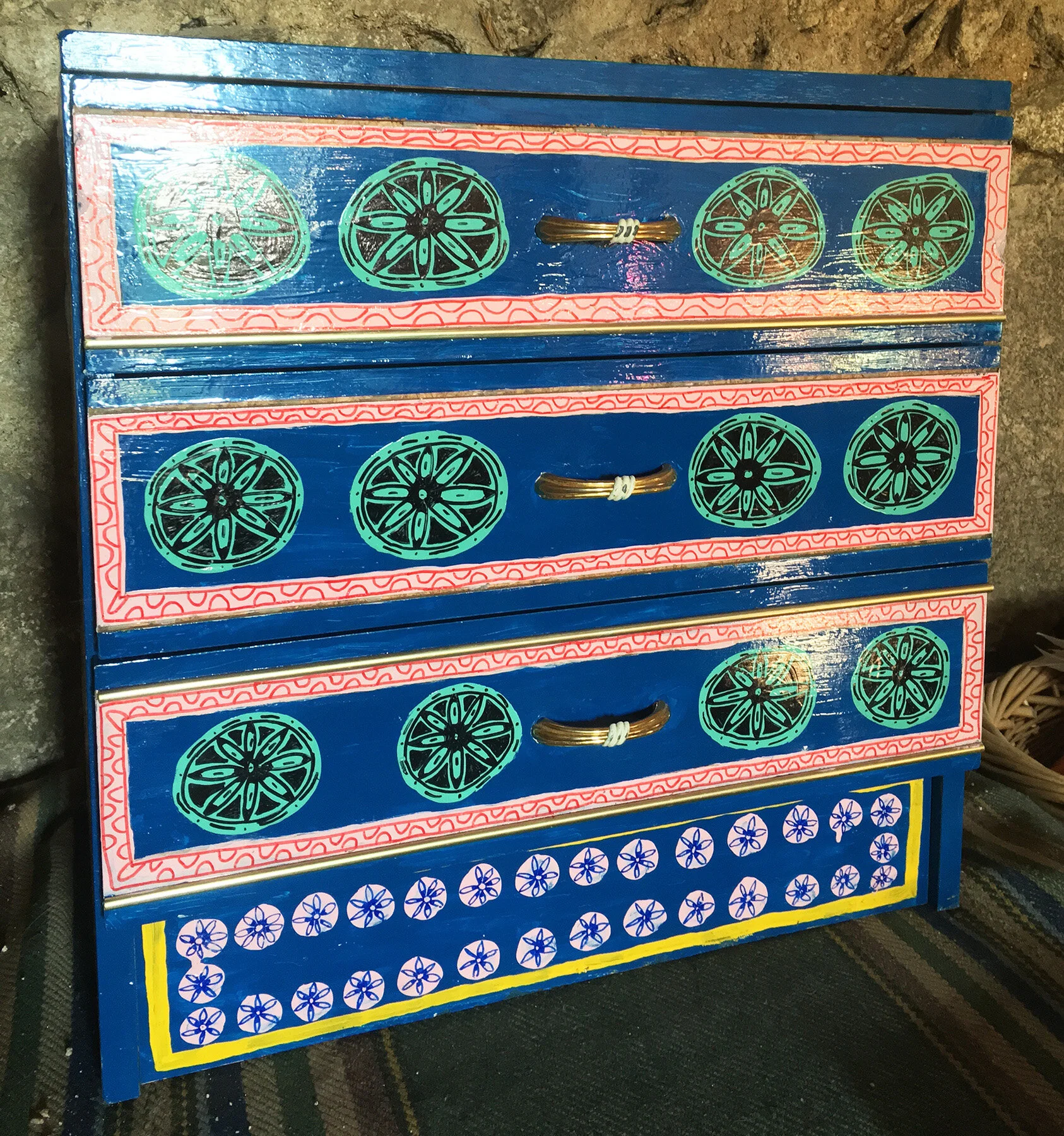 Close-up of painted furniture artwork by Taylor Meagher