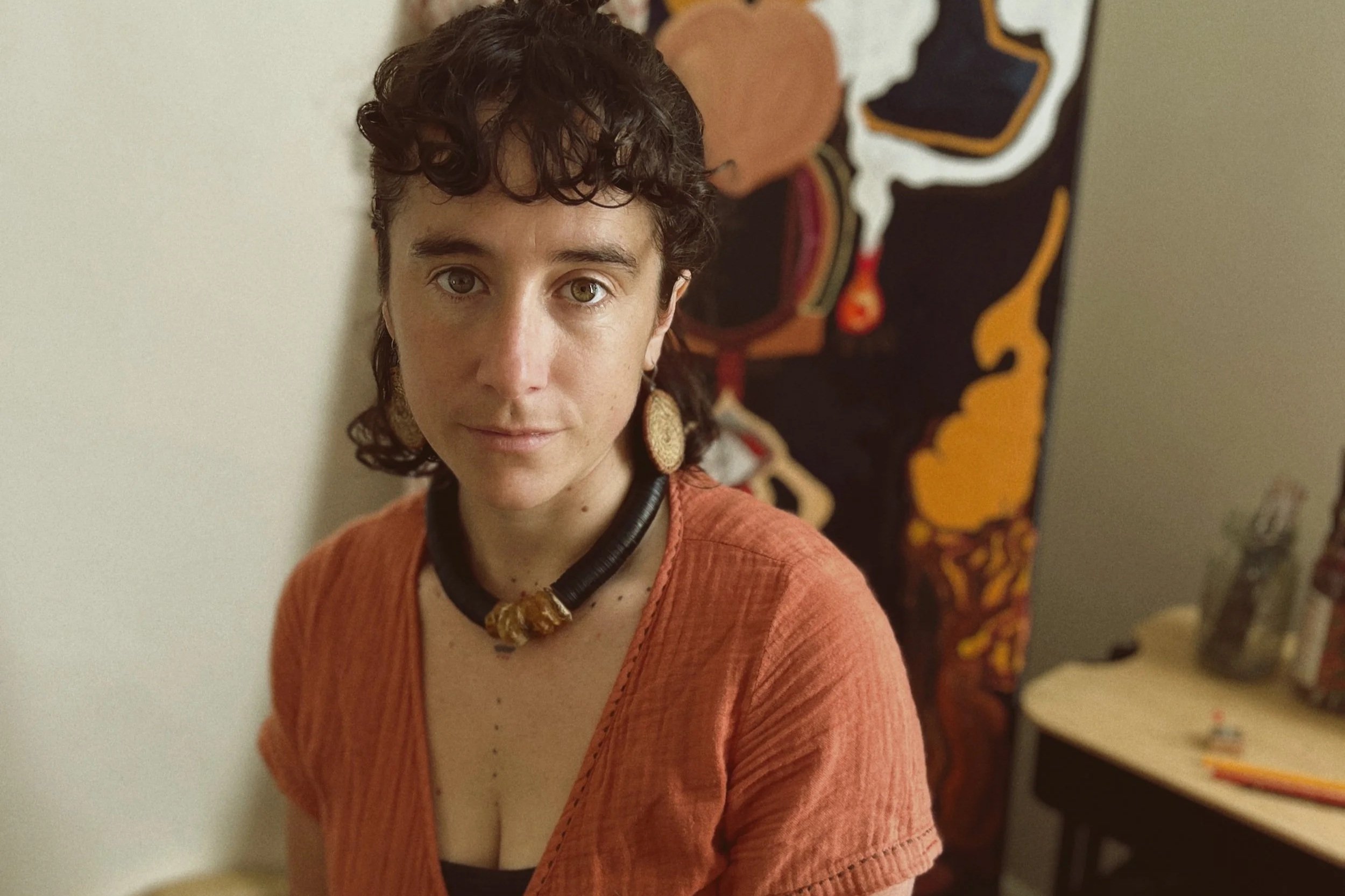 Taylor Meagher Australian artist and founder of Red Lines Dancing with her artwork