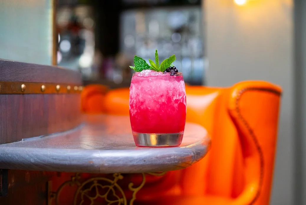 WINTER CHERRY : Absolut Vodka, Lejay Cherry Brandy, Plum Bitters, Grenadine and Lemon Juice