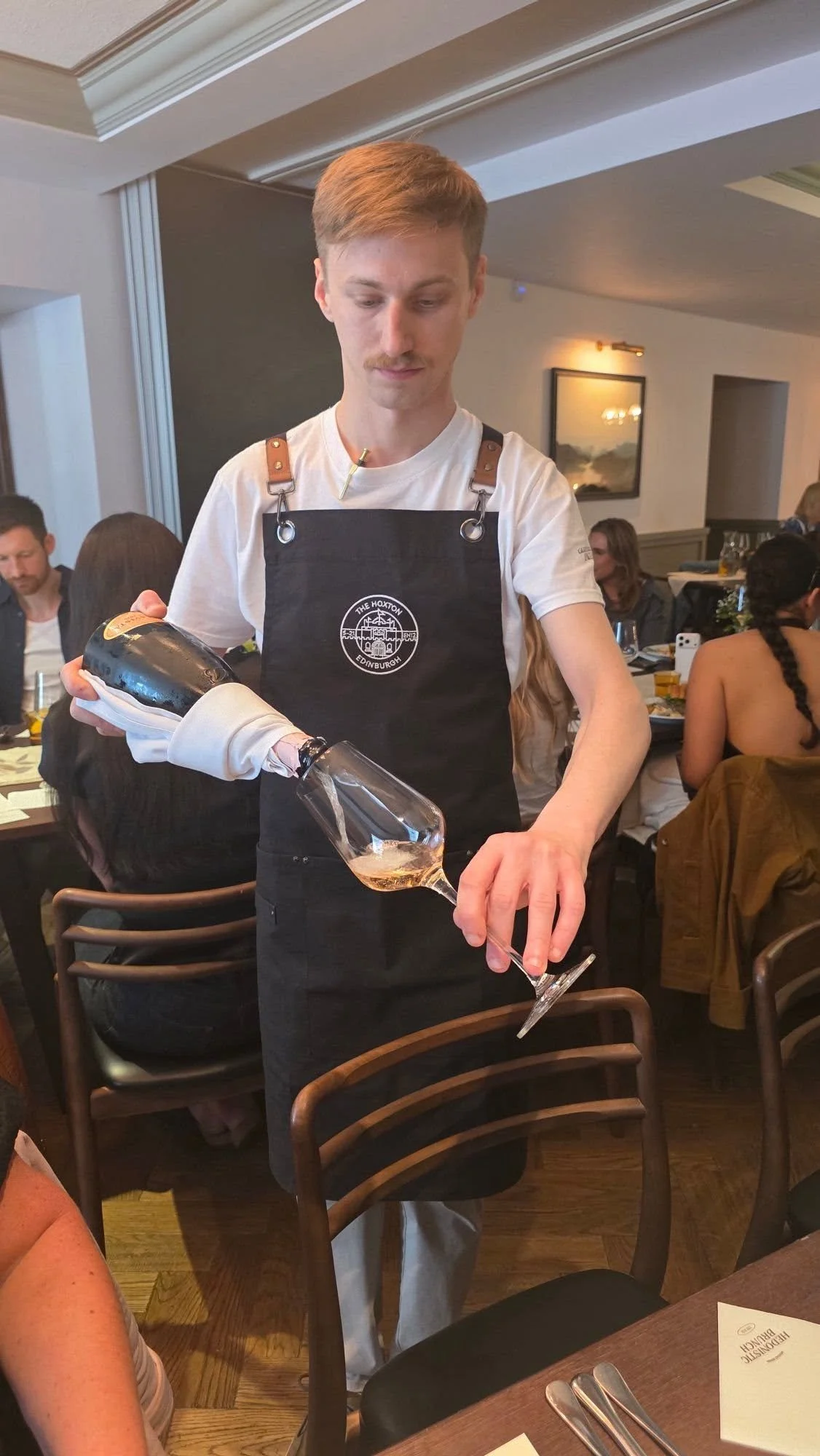 Hoxton Brunch wine pouring.jpg