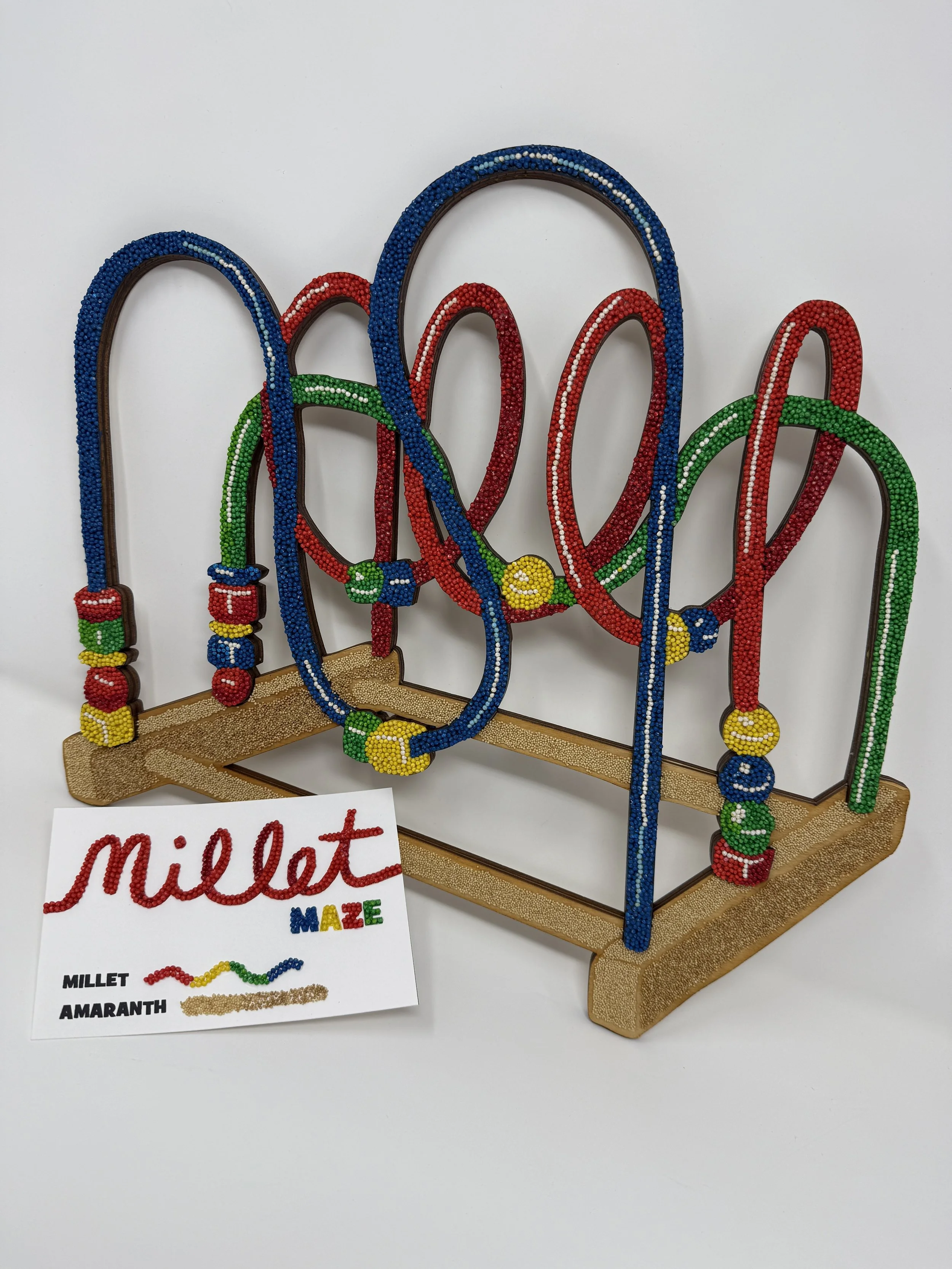 Millet Maze, made for the 2025 Crop Art Exhibition at the Minnesota State Fair. It placed 6th in Class 5 — Artistic, irregular forms, amateur out of 40 entries.
