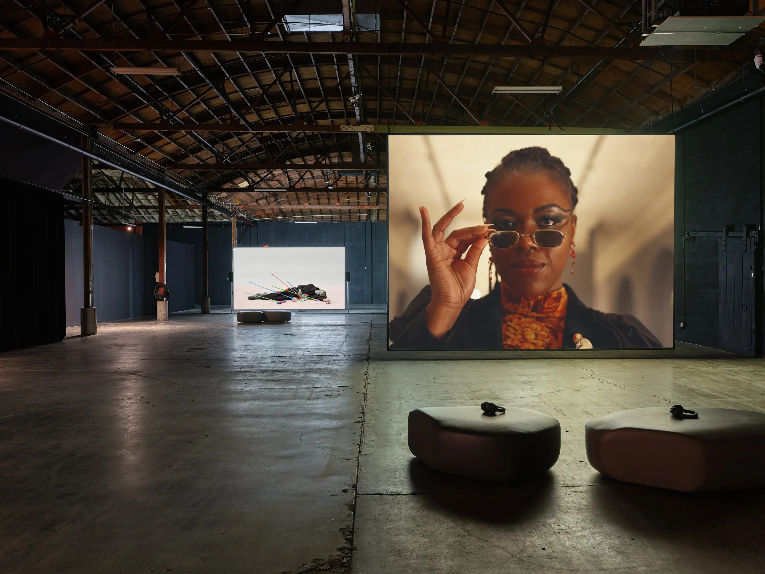   Sophia Al-Maria,  Tiger Strike Red  (2022) ;  Alex Da Corte,  Slow Graffiti  (2017) . Courtesy of the artists; The Third Line, Dubai; and the KADIST collection. Installation view,  Character Development , at Minnesota Street Project Foundation, Sep