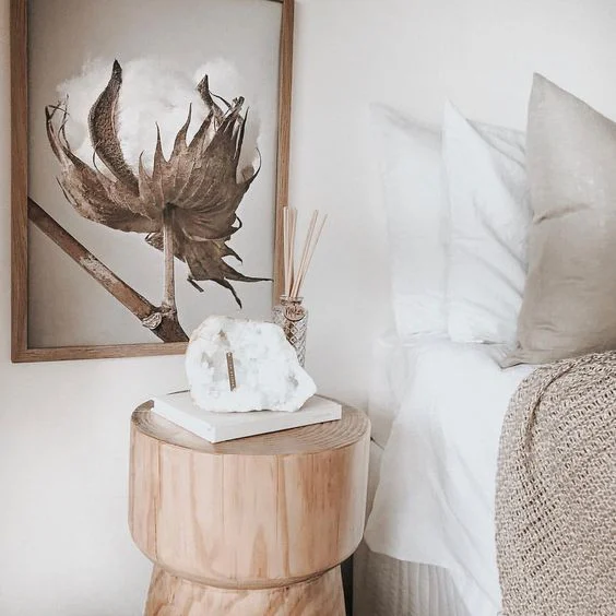 Cosy minimalism article. Image of bedside table and blankets in different textures.jpg