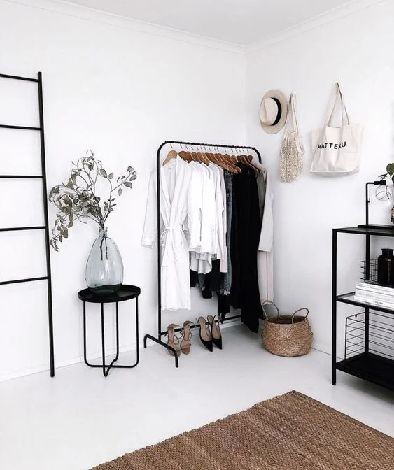 The Ultimate Decluttering Guide article. Image of minimalist storage in bedroom.jpg