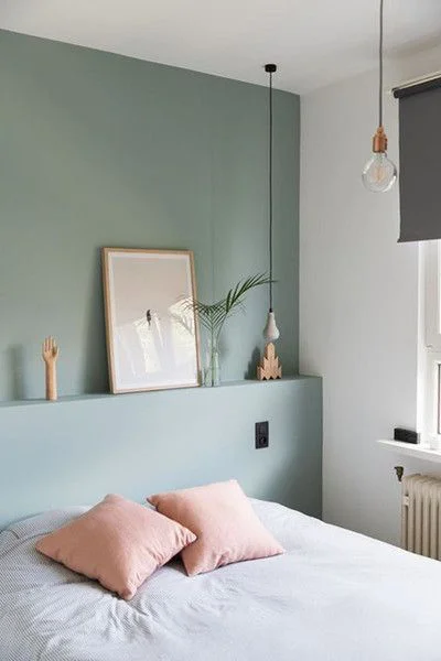 Cosy Room article. Image of bed with green accent wall behind it.jpg
