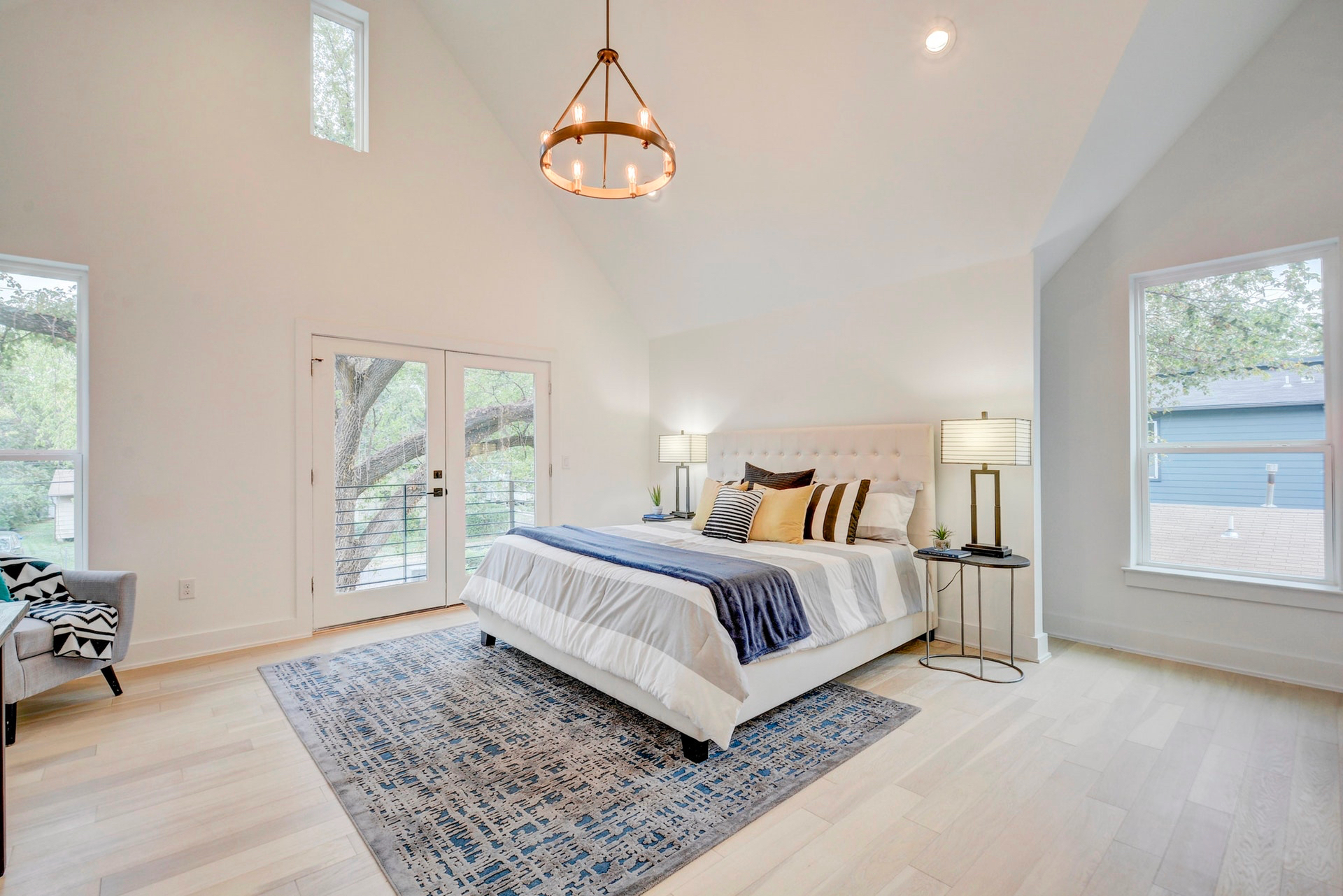 Bright master bedroom with several windows