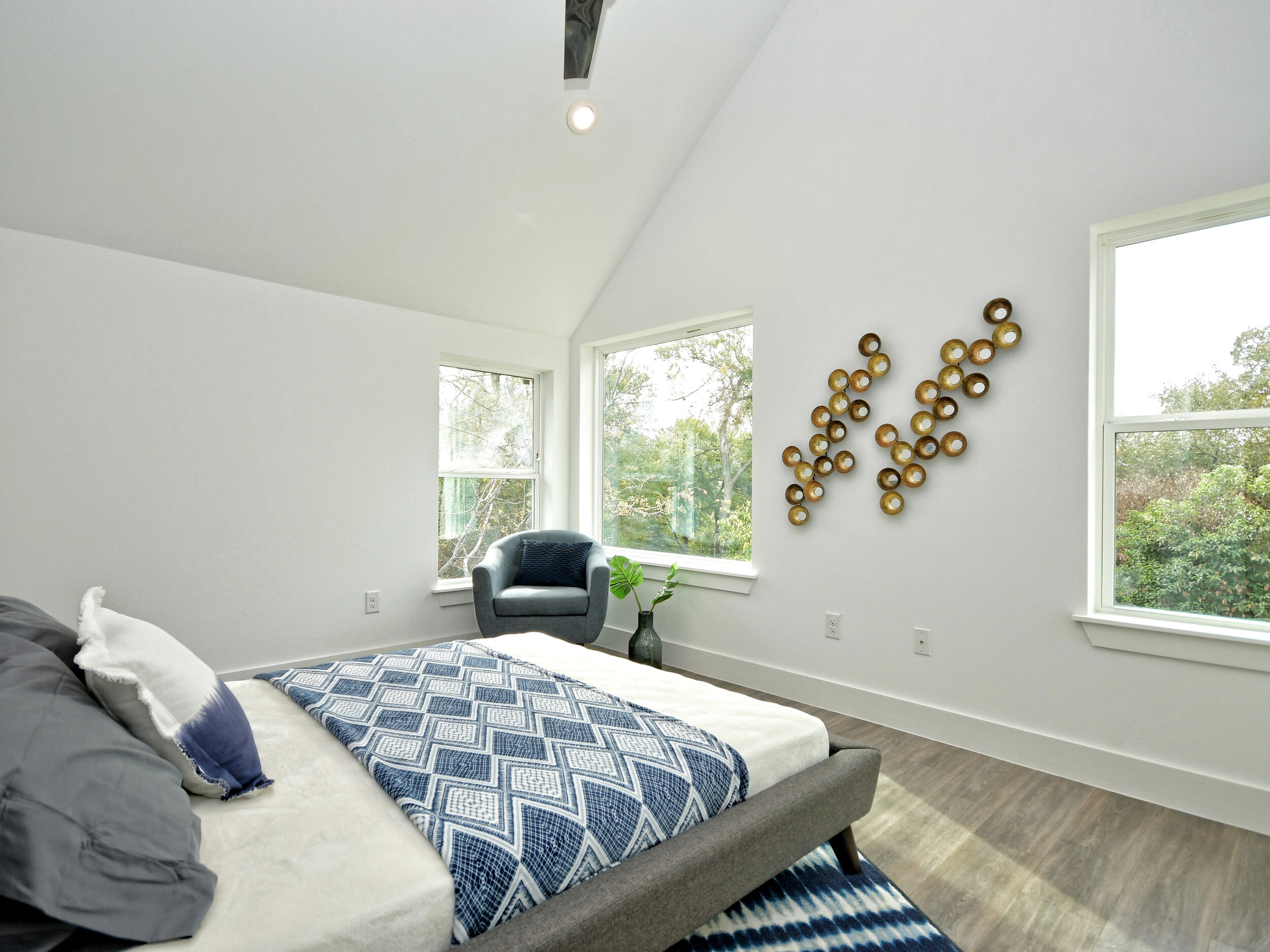 Master bedroom with several large windows