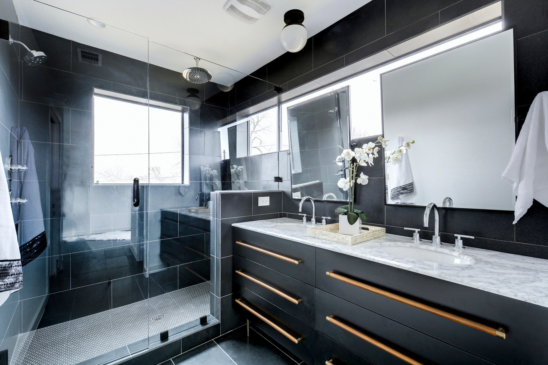 Stunning dark tiled bathroom