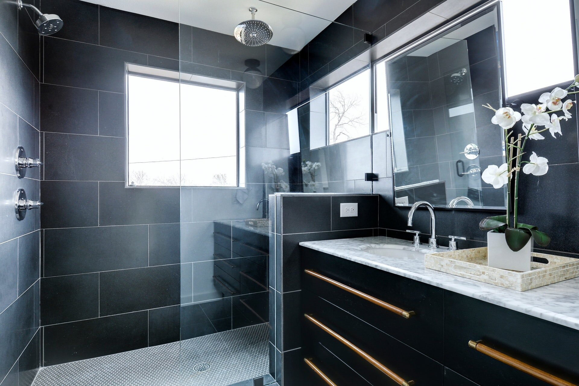 Beautiful contrast between dark tile and bright natural light through the windows