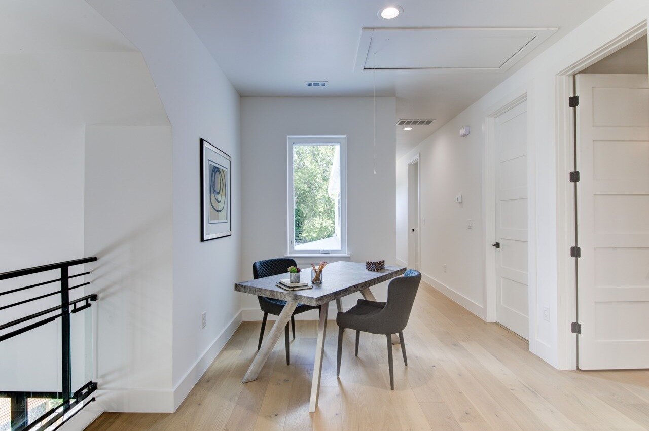 Large upstairs hallway with plenty of space for furniture or a desk