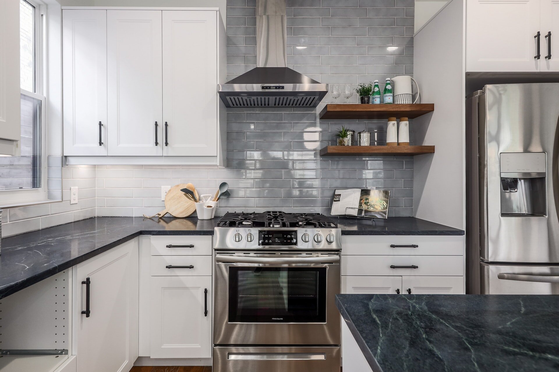 Kitchen with beautiful counter to ceiling backsplash