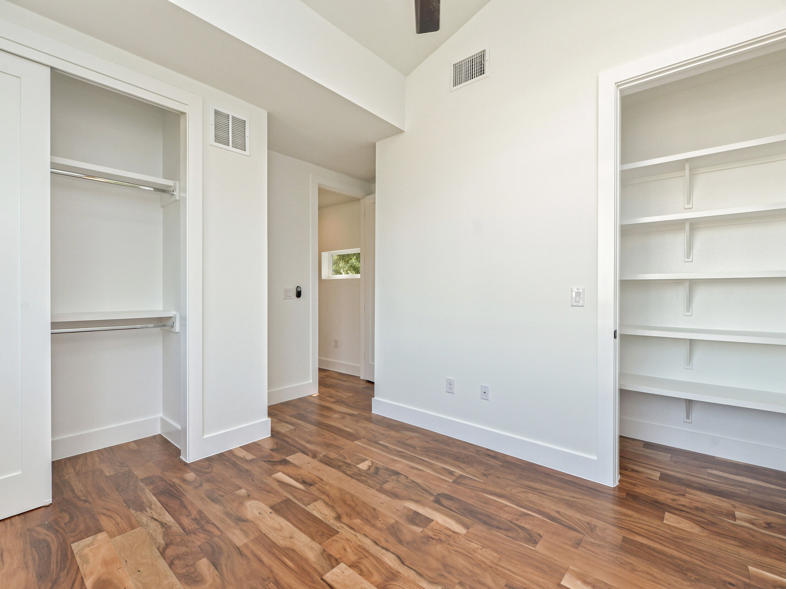 Bedroom with built-in shelves