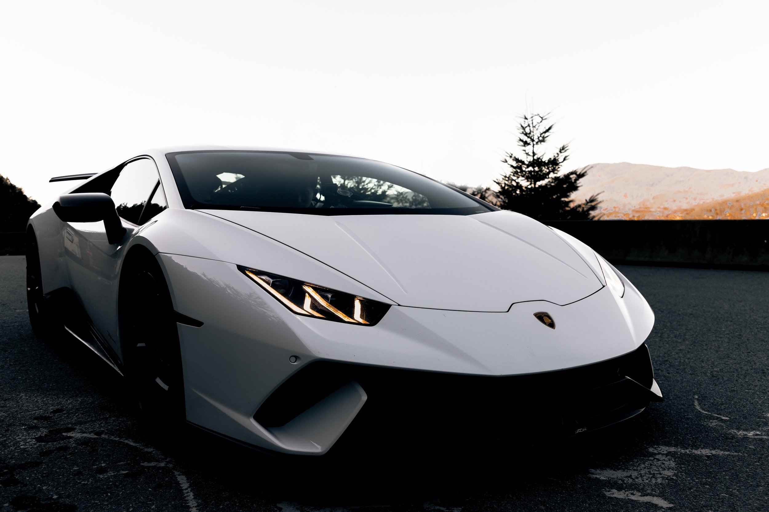 white lamborghini in mountains.jpg