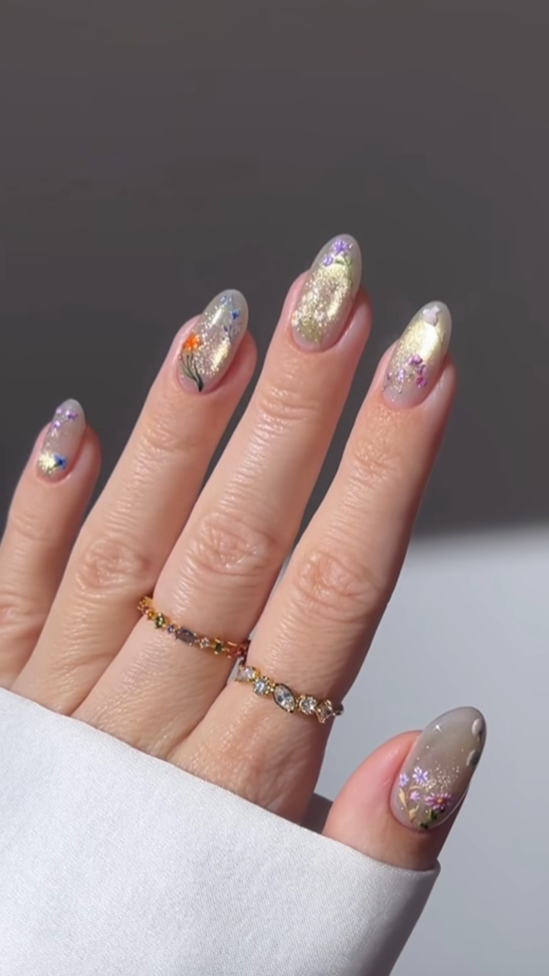 Pastel spring nails with fine glitter overlay for subtle sparkle