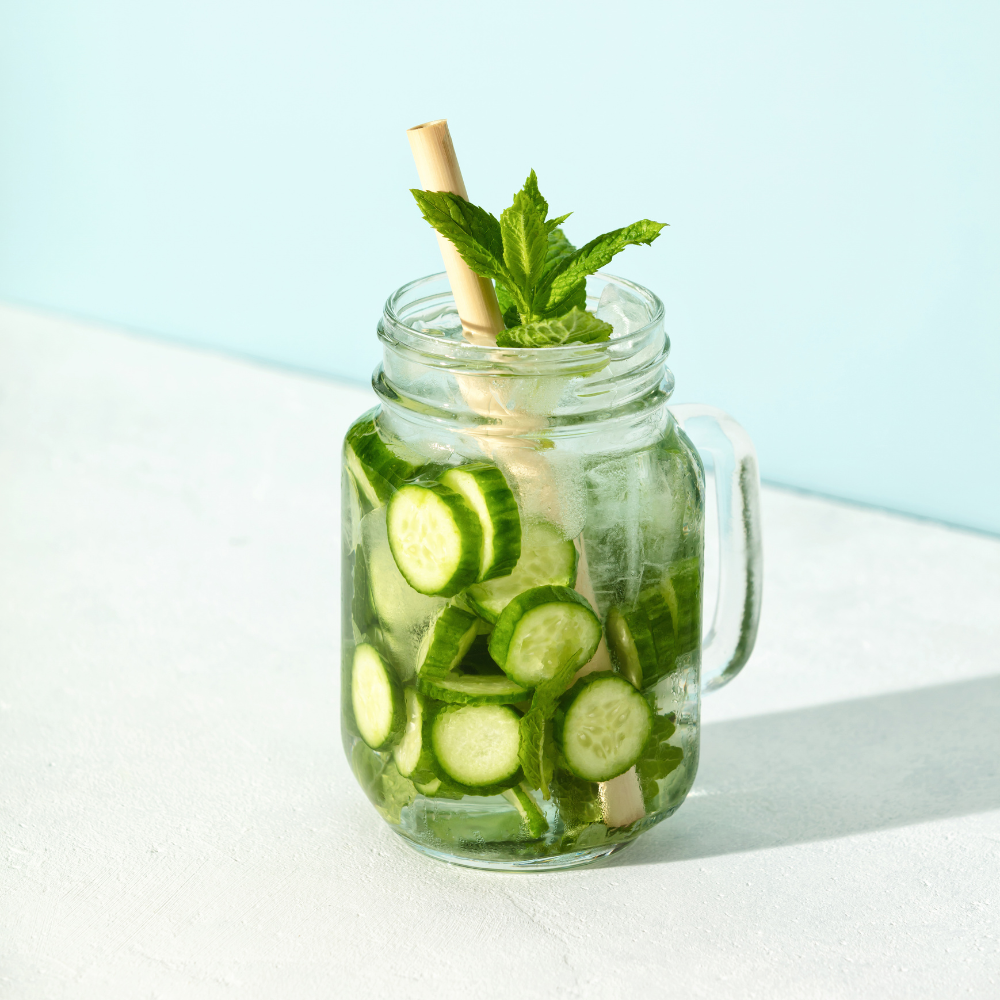 Hydrating cucumber mint nonalcoholic summer drink with sparkling water, cucumber slices, and fresh mint