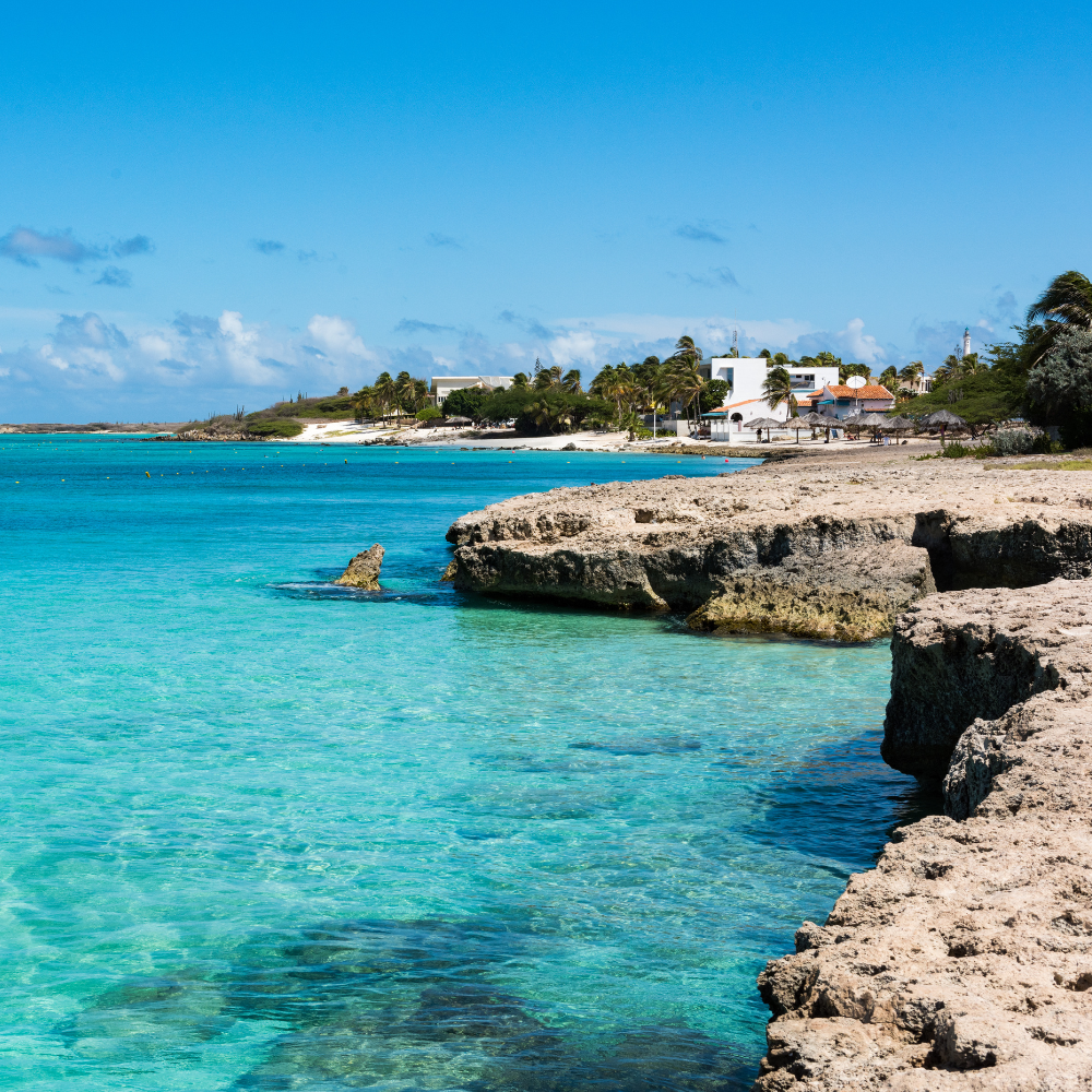 Arashi Beach Aruba with wide sandy shoreline and beach shack for drinks