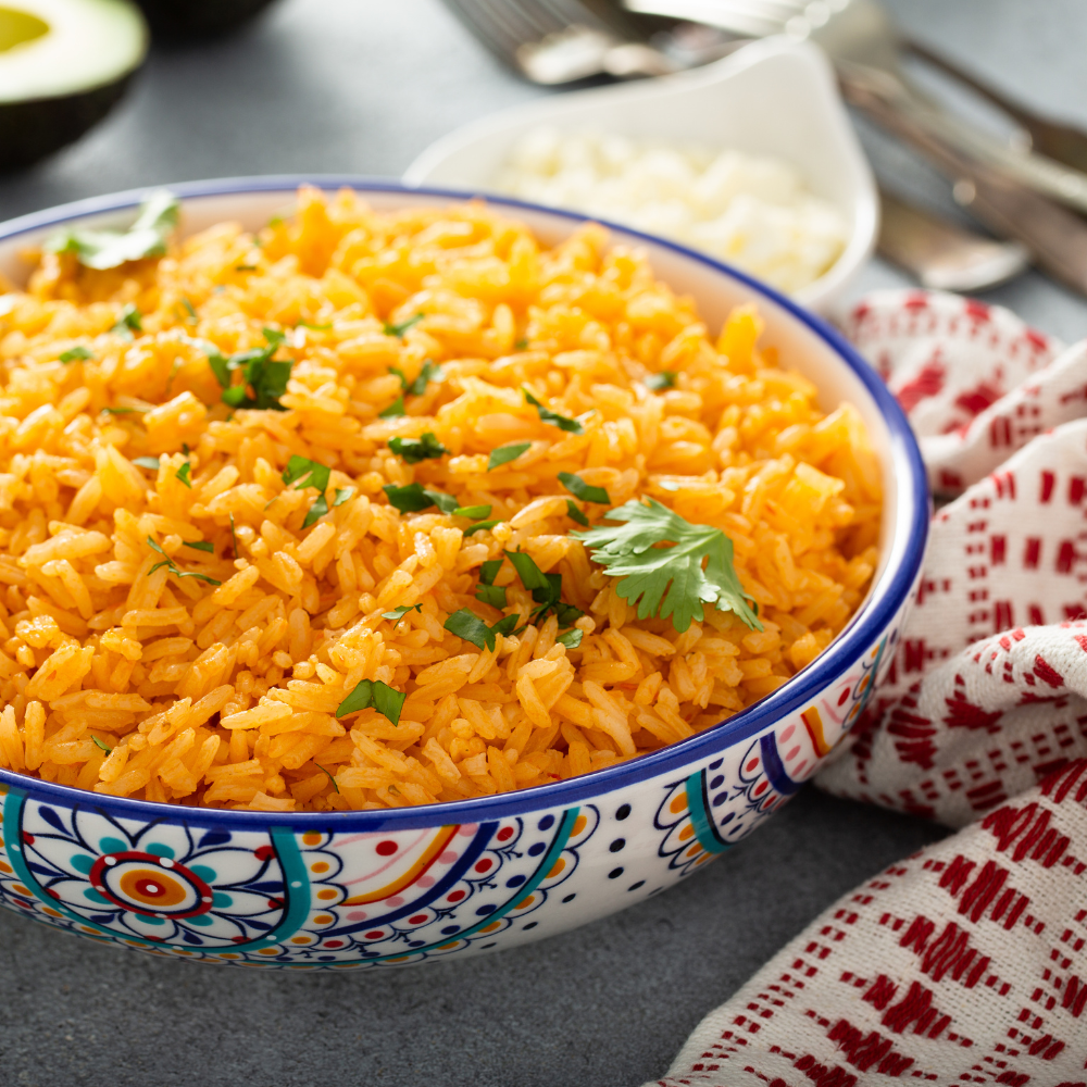 Long-grain rice toasting in a pan with oil for Spanish rice