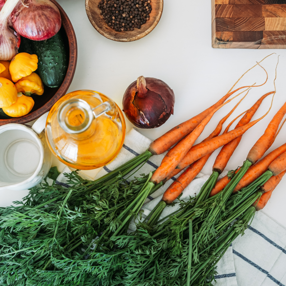Ingredients for ham and bean soup including beans, ham, onions, garlic, carrots, potatoes, and fresh parsley.