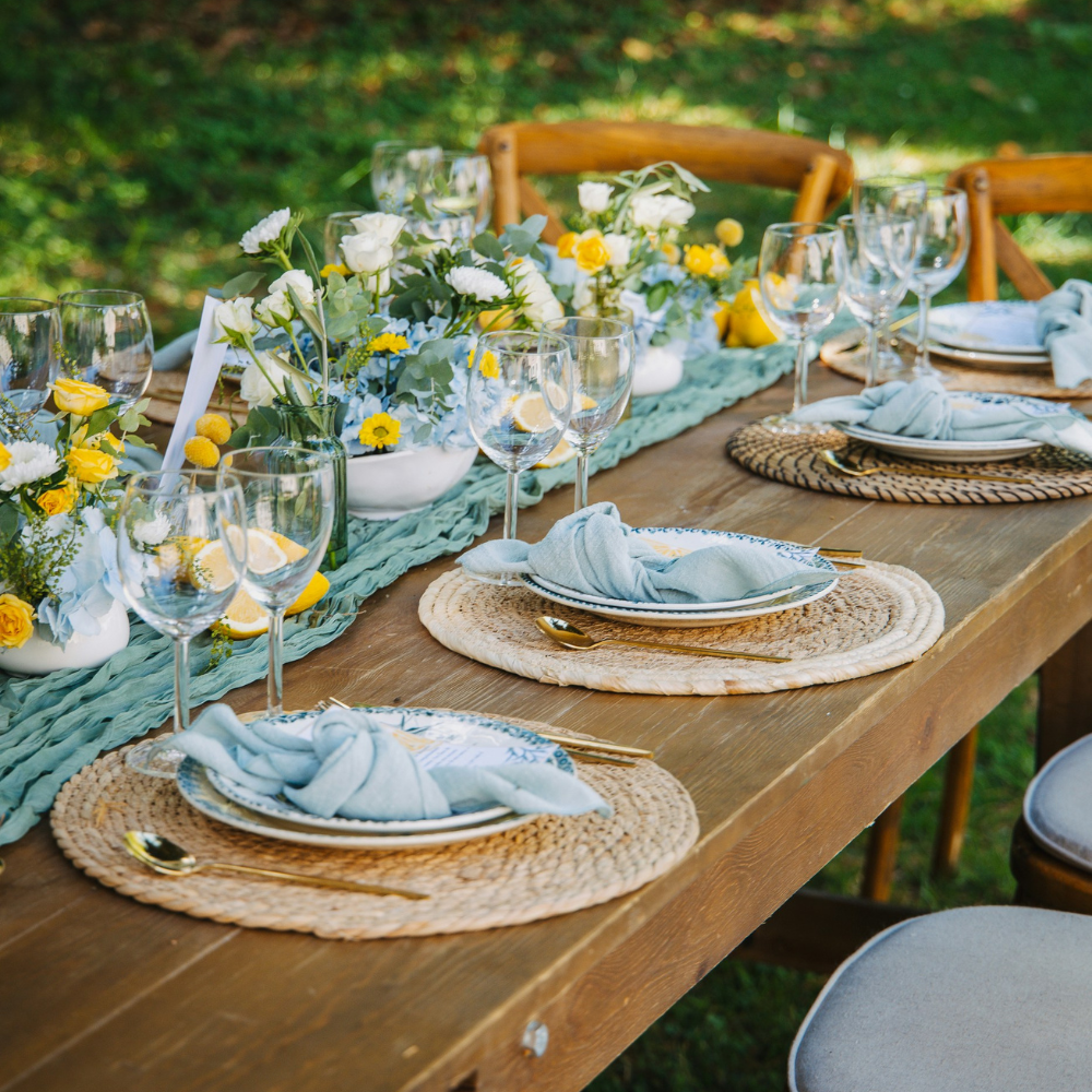 Garden party decor with lemons, oranges, and blue linens inspired by Mediterranean themes