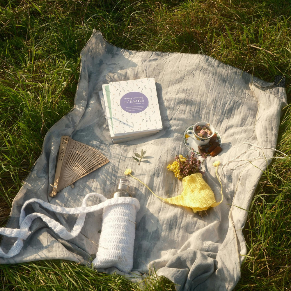 Elegant tea party picnic with sandwiches, scones, floral decorations, and tea for couples or friends