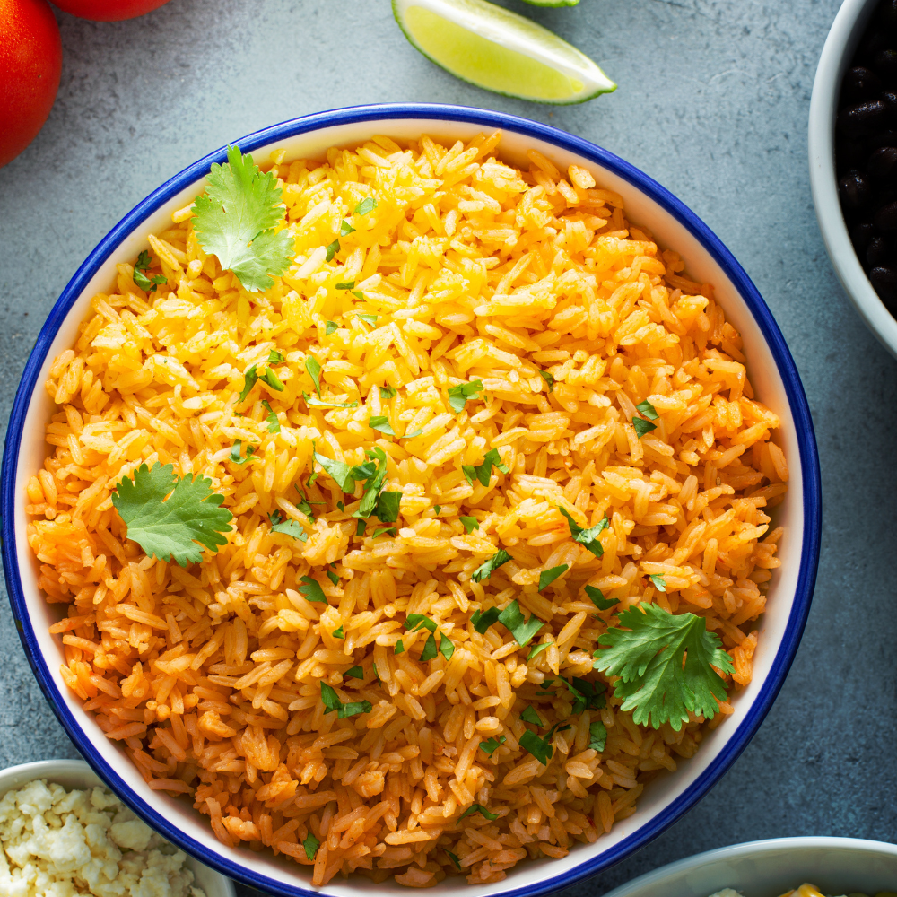 Spanish rice served as a side dish with beans and vegetables
