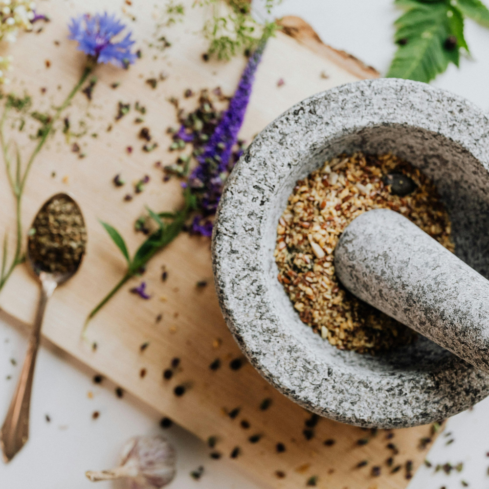 Crushing spices to make chai tea latte